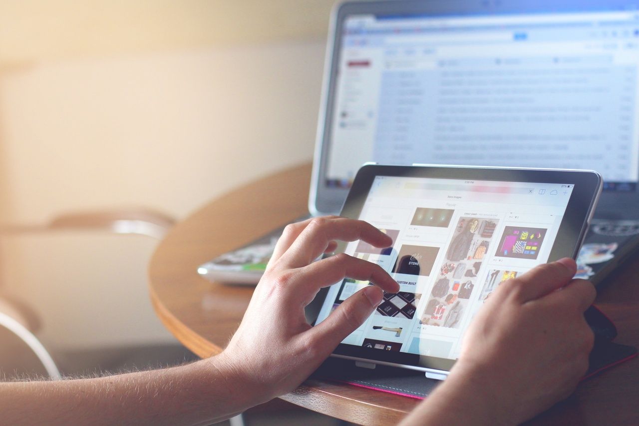 person holding black tablet