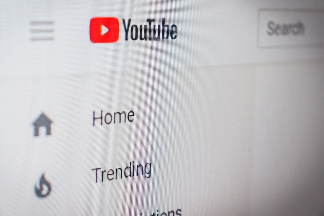 youtube logo, menu items like home and trends view