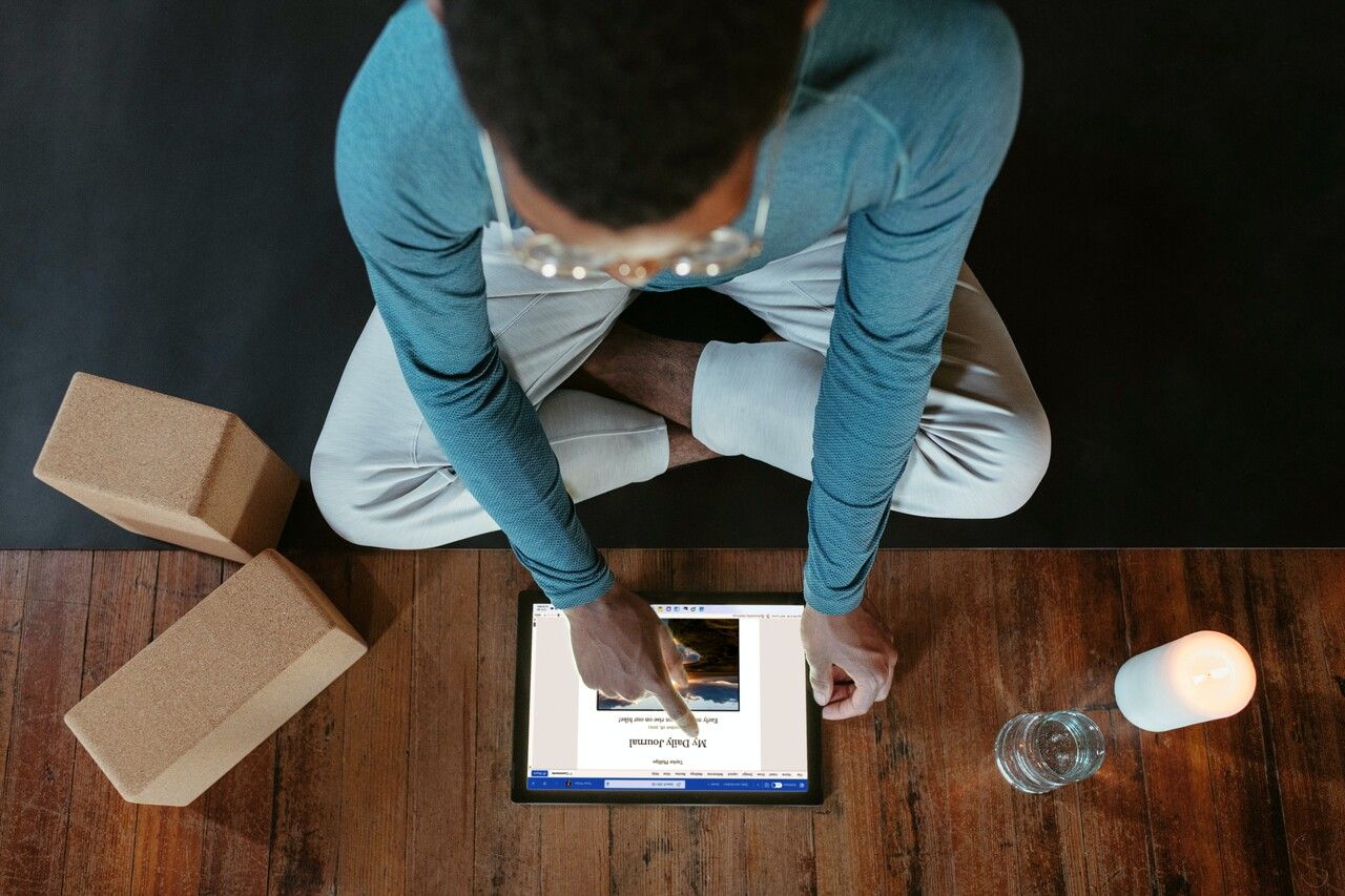 a person examining the word document on tablet