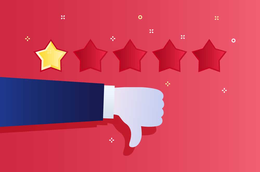 thumbs down and one out of five stars on red background